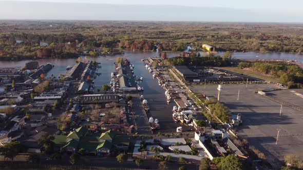 Waterfront village on riverbank in Tigre, Buenos Aires in Argentina. Aerial drone pov alt