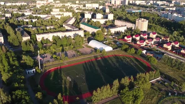 Aerial View of Football Stadium At Sunset alt