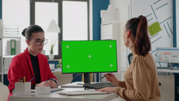 People Doing Teamwork with Green Screen on Monitor alt