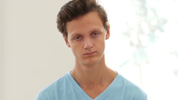 Denying Offer by Shaking Head, Young Man Portrait alt