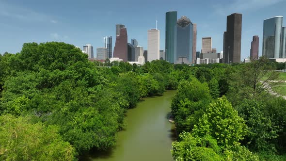 Buffalo Bayou river and park with Houston Texas city skyline panorama. Aerial view. alt