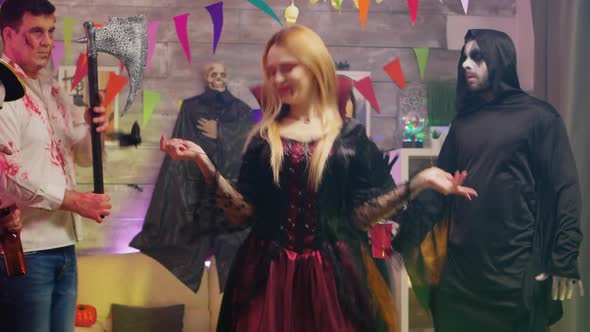 Evil Beautiful Enchantress Dancing at Halloween Party alt