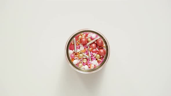 Colorful pink sprinkle blend on a white background. alt