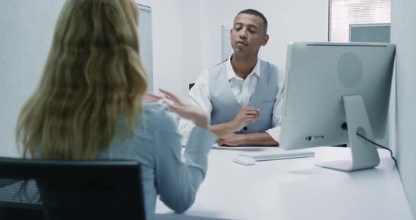 Business man and woman speaking alt
