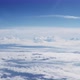View Through Plane Window on a Beautiful Blue Sky and Sea of Clouds - VideoHive Item for Sale