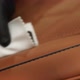 Waxing with a White Sponge on a Leather Car Seat Closeup - VideoHive Item for Sale