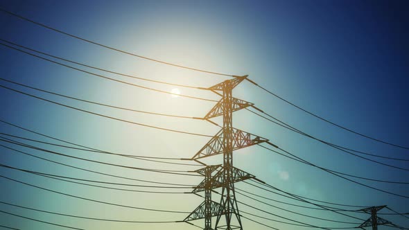 Endless electric powerlines and pylons loopable animation on a cloudless sky. HD alt