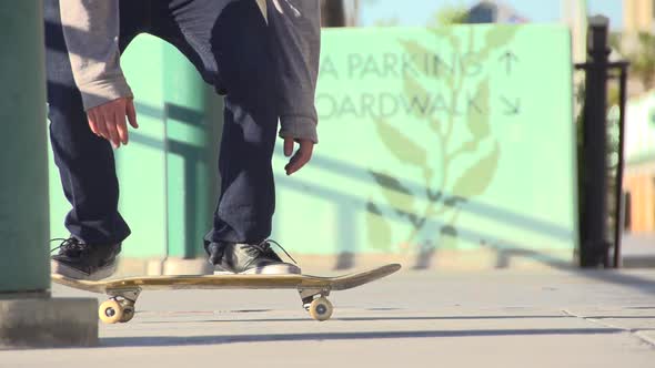 A young man skateboarding. alt
