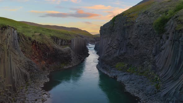 Flying Through the Studlagil Canyon in East Iceland at Sunset alt