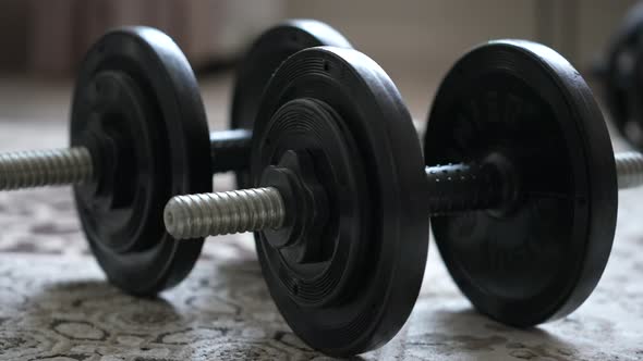 Dumbbells Collapsible Lie in the Room on the Carpet at Home Clouse Up