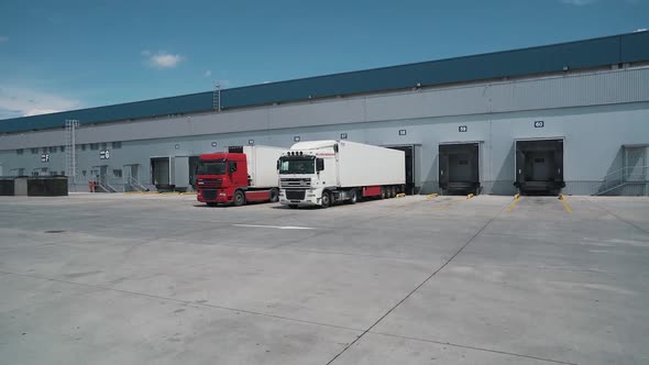 Trucks Depart From the Logistics Center
