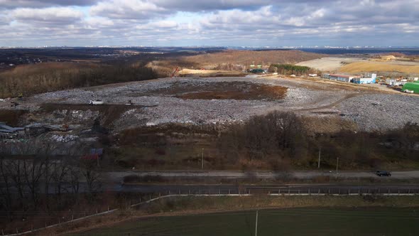 Aerial drone view of stack of different types of large mountain garbage pile alt
