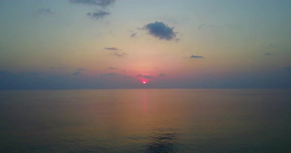 Wide angle above copy space shot of a sandy white paradise beach and aqua blue ocean background in h alt