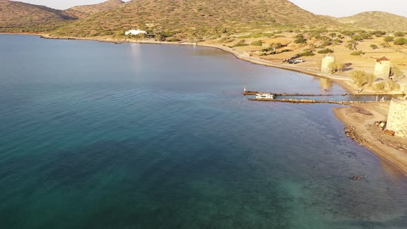 Aerial View of a Motor Boat in a Deep Blue Colored Sea. Kolokitha Island, Crete, Greece