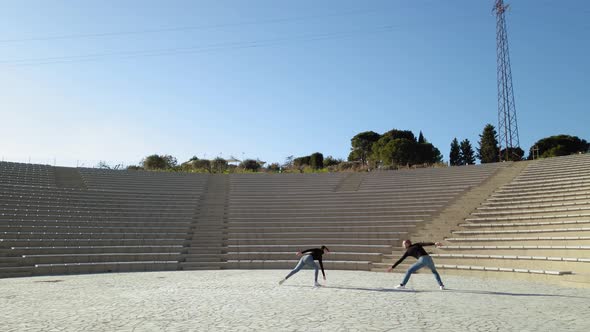 Man and woman couple dancers at outdoor theater alt