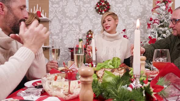 Cheerful Family Making a Toast with Champagne alt
