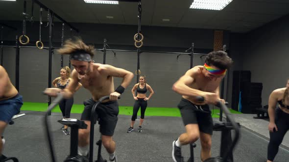 Athletes doing air bike workout alt