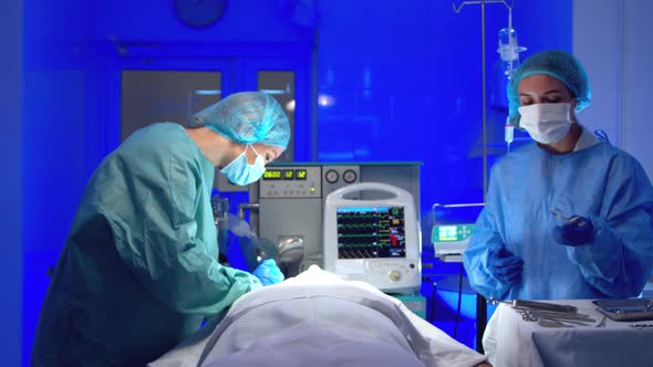 Surgeon Doing Surgery in Operating Room in Hospital