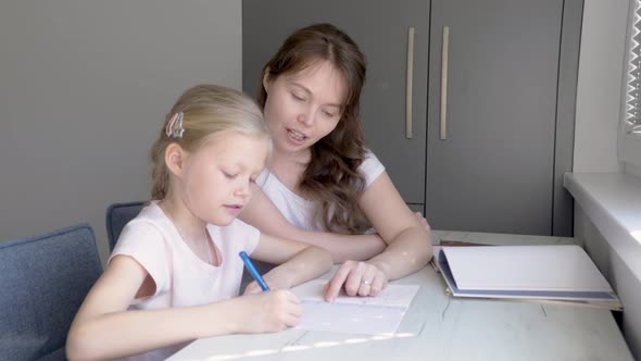 Mother and Daughter Doing Homework Together