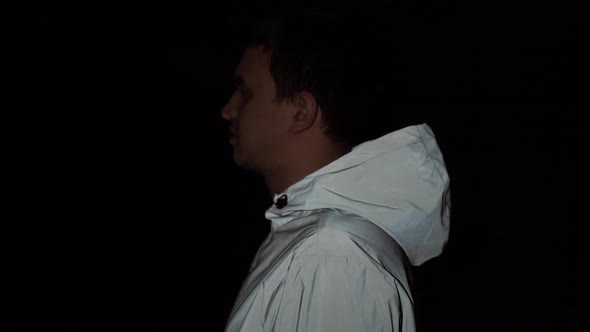 Profile of Attractive Young Man Standing Straight and Looking Forward Wearing Reflective Jacket