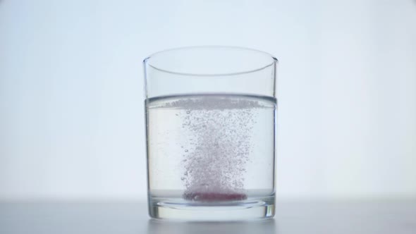 Medicine: Glass of Water with Soluble Effervescent Pill with Sparklig Bubbles alt