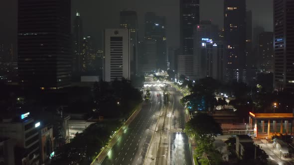 Aerial Dolly Forward Flying Shot of Almost Empty Multi Lane Highway at Night During Covid 19 alt