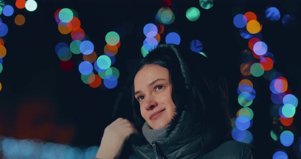 Beautiful and Happy Woman is Walking in the Night City the Lights are on alt