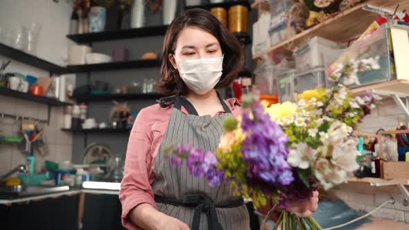Sick Female in Preventive Mask Checking Estimating Bouquet Arrangement. Florist in Shop Holding