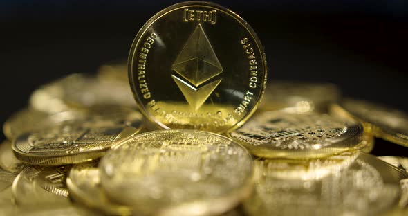 Cryptocurrency Real Golden Coins With Ethereum Logo On Black Background