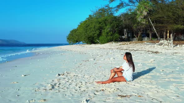 Tourists happy together on paradise lagoon beach wildlife by shallow sea and white sand background o alt