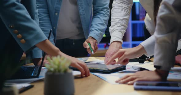 Coworkers which Brainstorming Start Up Project, Revisioning Details from Tablet Device and Thumbs Up alt