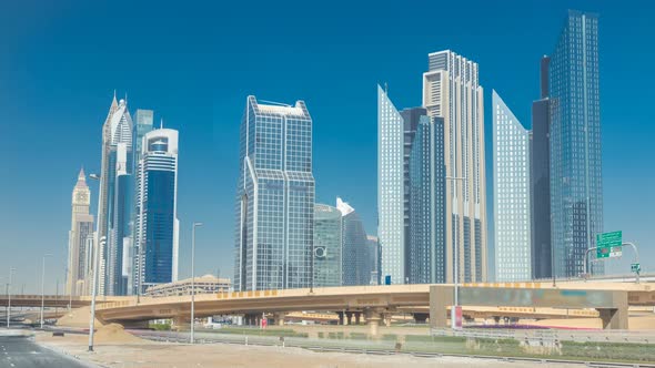 Busy Sheikh Zayed Road Timelapse Metro Railway and Modern Skyscrapers Around in Luxury Dubai City alt