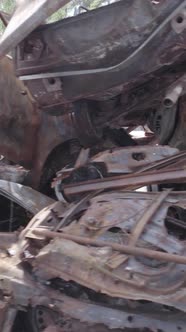 Vertical Video of a Dump of Destroyed Cars During the War in Ukraine alt