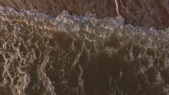 Aerial Drone View of Tropical Beach Ocean Waves Reaching Shore alt