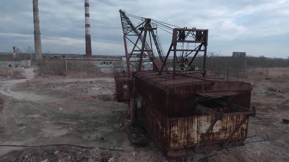 FPV Drone Flies Maneuverable Near Abandoned Walking Excavator alt