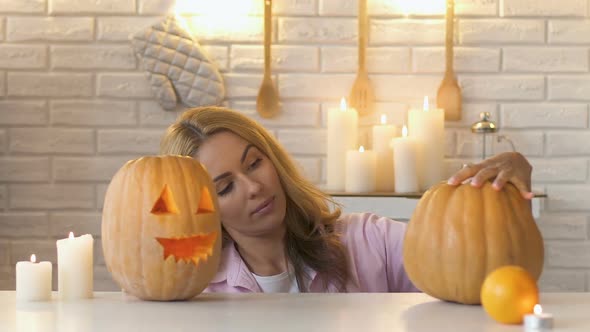 Woman Looking at Pumpkins Handmade Work, Preparation for Halloween, Slow-Mo alt