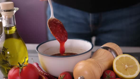Preparing a Marinade Sauce for Bbq in a Domestic Kitchen  Adding Tomato Sauce alt