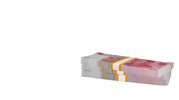 Many wads of money falling on table. 100 Chinese Yuan banknotes. alt