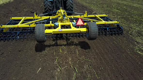 Tractor Working In The Agricultural Field alt