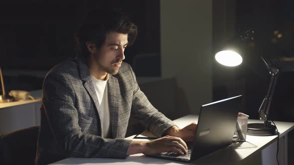 Closeup of a Man Rubbing His Eyes From Fatigue and Night Work at the Computer alt