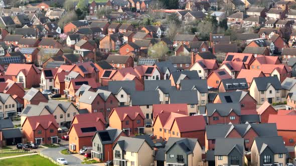 New Houses and Homes on a UK New Build Estate Seen From The Air alt