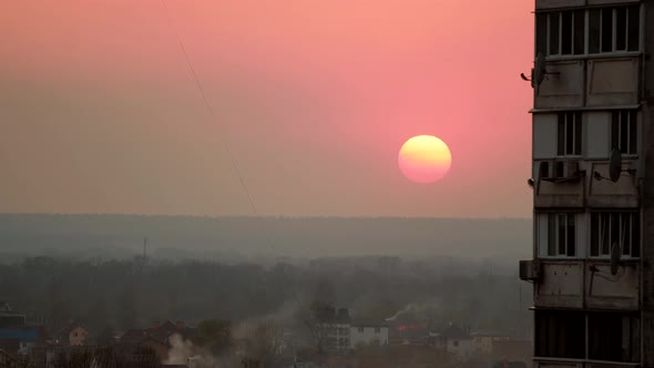 Timelapse Sunset In City With Countryside Silhouette. Sunset Behind Buildings In Kiev City Ukraine. alt