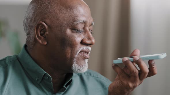 Mature Greyhaired 60s Biracial Man with Beard African American Senior Old Male at Home Hold alt