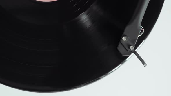 Vinyl Record Is Spinning on a Turntable with Arm and Needle alt