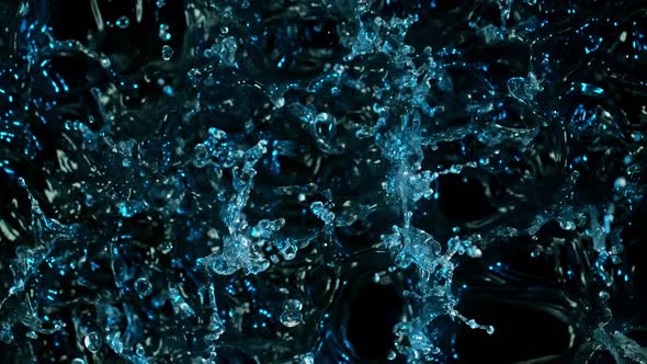 Super Slow Motion Abstract Shot of Splashing Blue Neon Water at 1000Fps alt