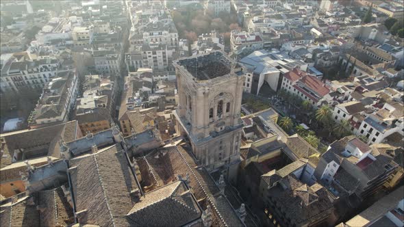 Aerial orbiting over tower bell of Granada Cathedral, Spain