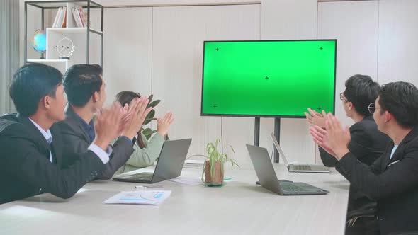 Asian Team Have Meeting In A Conference Room, Have Conference Video Call Tv Mock Up Green Screen alt
