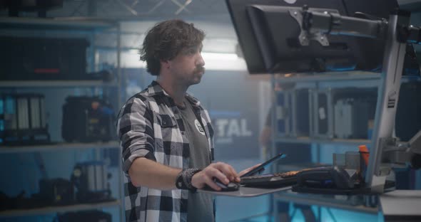 Clerk Working in Video Equipment Store alt