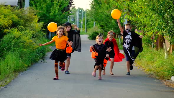 Children are Celebrating Halloween in Costumes alt