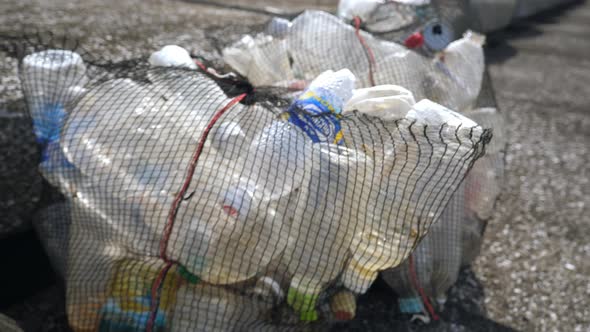 Plastic Bottles Put Inside the Net Bag in Koijigahama Beach in Tahara Japan